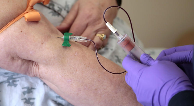 In this Tuesday, April 28, 2015 file photo, a patient has her blood drawn at a hospital in Philadelphia to monitor her cancer treatment. In this Tuesday, April 28, 2015 file photo, a patient has her blood drawn at a hospital in Philadelphia to monitor her cancer treatment.