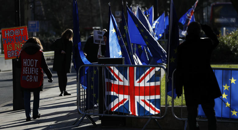 Pro and Anti Brexit protesters demonstrate outside the Houses of Parliament in London, Monday, Jan. 28, 2019. Pro and Anti Brexit protesters demonstrate outside the Houses of Parliament in London, Monday, Jan. 28, 2019.