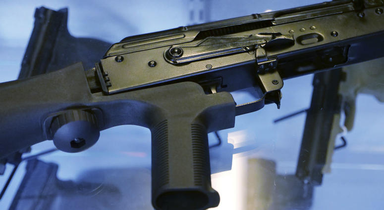 This Oct. 4, 2017 file photo shows a device called a "bump stock" attached to a semi-automatic rifle at a gun store and shooting range in Utah. This Oct. 4, 2017 file photo shows a device called a "bump stock" attached to a semi-automatic rifle at a gun store and shooting range in Utah.