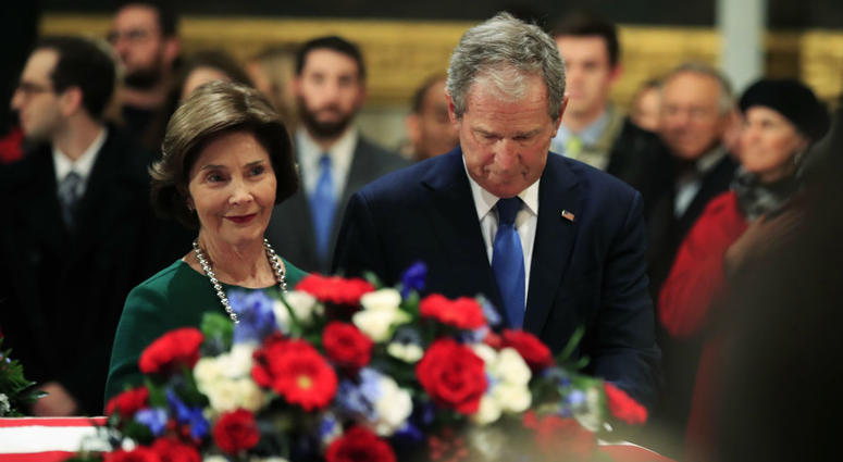 Former President George W. Bush and former first lady Laura Bush pay their respect to his father former President George H.W. Bush as he lie in state at the U.S. Capitol in Washington, Tuesday, Dec. 4, 2018. Former President George W. Bush and former first lady Laura Bush pay their respect to his father former President George H.W. Bush as he lie in state at the U.S. Capitol in Washington, Tuesday, Dec. 4, 2018.