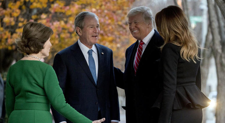 President Donald Trump and first lady Melania Trump are greeted by former President George Bush and former first lady Laura Bush outside the Blair House across the street from the White House in Washington, Tuesday, Dec. 4, 2018. President Donald Trump and first lady Melania Trump are greeted by former President George Bush and former first lady Laura Bush outside the Blair House across the street from the White House in Washington, Tuesday, Dec. 4, 2018.