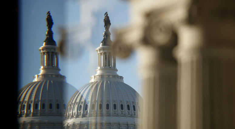 The U.S. Capitol Building Dome is seen through a beveled window at the Library of Congress in Washington, Wednesday, Dec. 19, 2018. The U.S. Capitol Building Dome is seen through a beveled window at the Library of Congress in Washington, Wednesday, Dec. 19, 2018.
