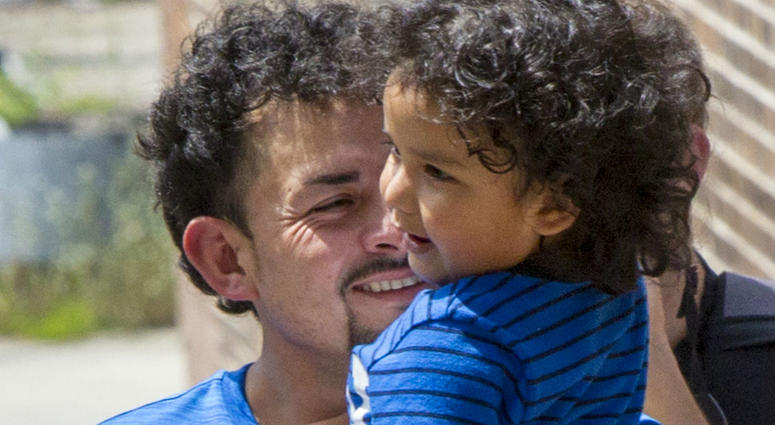 Ever Reyes Mejia is reunited with his 3-year-old son at the U.S. Immigration and Customs Enforcement (ICE) office building in Grand Rapids, Mich., on Tuesday, July 10, 2018. Ever Reyes Mejia is reunited with his 3-year-old son at the U.S. Immigration and Customs Enforcement (ICE) office building in Grand Rapids, Mich., on Tuesday, July 10, 2018.