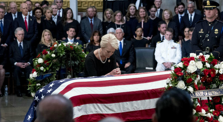 Cindy McCain, wife of, Sen. John McCain, R-Ariz., pauses at her husband's casket as he lies in state in the Rotunda of the U.S. Capitol, Friday, Aug. 31, 2018, in Washington. Cindy McCain, wife of, Sen. John McCain, R-Ariz., pauses at her husband's casket as he lies in state in the Rotunda of the U.S. Capitol, Friday, Aug. 31, 2018, in Washington.