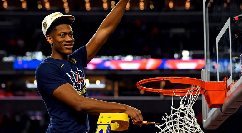 Virginia Cavaliers guard De'Andre Hunter (12) cuts down the net after beating the Texas Tech Red Raiders in the championship game of the 2019 men's Final Four at US Bank Stadium in Minneapolis. Virginia Cavaliers guard De'Andre Hunter (12) cuts down the net after beating the Texas Tech Red Raiders in the championship game of the 2019 men's Final Four at US Bank Stadium in Minneapolis.