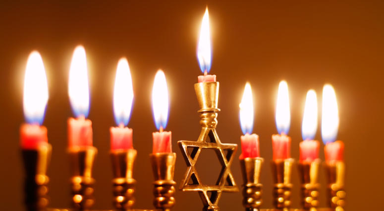 Brightly lit menorah on the eighth night of Hanukkah. Hanukkah menorah
