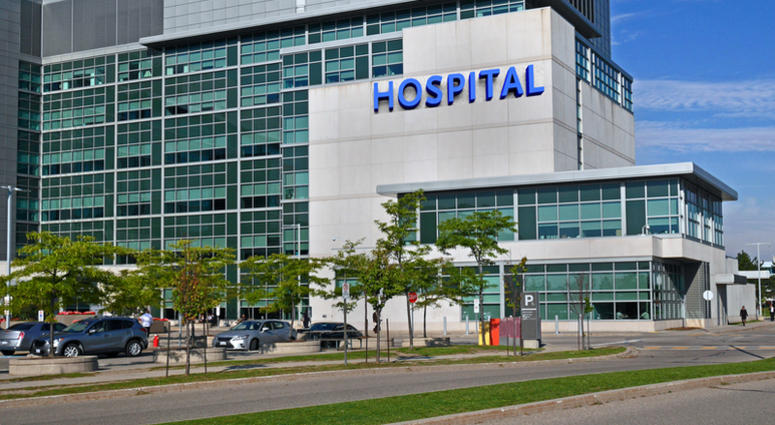 Modern hospital building and parking lot Hospital Generic