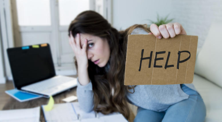 Young woman asking for help suffering stress doing domestic accounting paperwork bills. Expenses, home. Stress