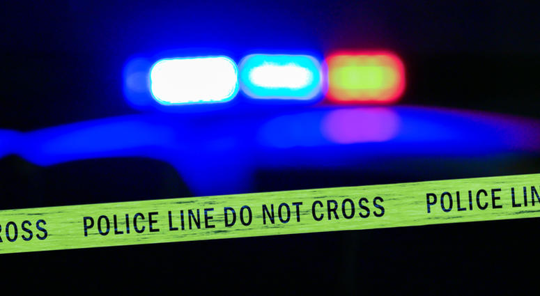 Close-up on siren on police car flashing, with crime scene boundary tape, Defocused Police Tape Generic
