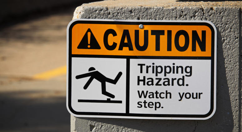 Caution tripping hazard sign on a wall Caution Sign