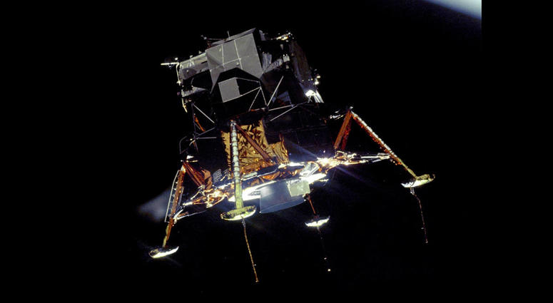 The Apollo 11 Lunar Module Eagle, in a landing configuration was photographed in lunar orbit from the Command and Service Module Columbia. The Apollo 11 Lunar Module Eagle, in a landing configuration was photographed in lunar orbit from the Command and Service Module Columbia.