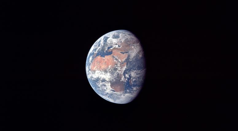 Earth at about 182,500 km or 98,500 nautical miles. North is up and the African continent is prominent. Also visible are Arabia, Asia and Europe, particularly Spain. Earth at about 182,500 km or 98,500 nautical miles. North is up and the African continent is prominent. Also visible are Arabia, Asia and Europe, particularly Spain.