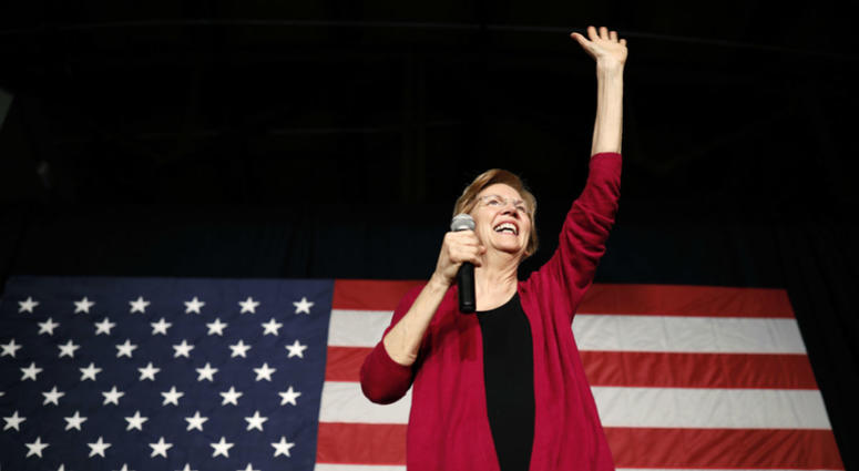In this Jan. 5, 2019, file photo, Sen. Elizabeth Warren, D-Mass, waves to the crowd during an organizing event at Curate event space in Des Moines, Iowa. In this Jan. 5, 2019, file photo, Sen. Elizabeth Warren, D-Mass, waves to the crowd during an organizing event at Curate event space in Des Moines, Iowa.