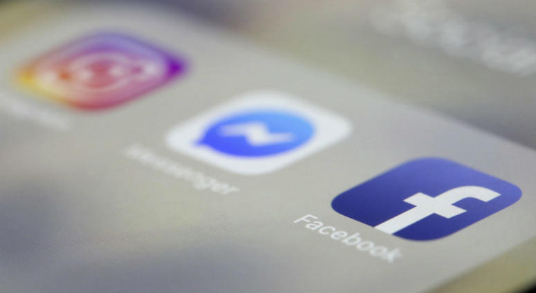 In this March 13, 2019, file photo Facebook, Messenger and Instagram apps are are displayed on an iPhone in New York. In this March 13, 2019, file photo Facebook, Messenger and Instagram apps are are displayed on an iPhone in New York.