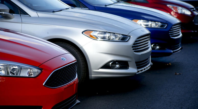 In this Nov. 19, 2015, photo, a row of new Ford Fusions are for sale on the lot at Butler County Ford in Butler, Pa. In this Nov. 19, 2015, photo, a row of new Ford Fusions are for sale on the lot at Butler County Ford in Butler, Pa.