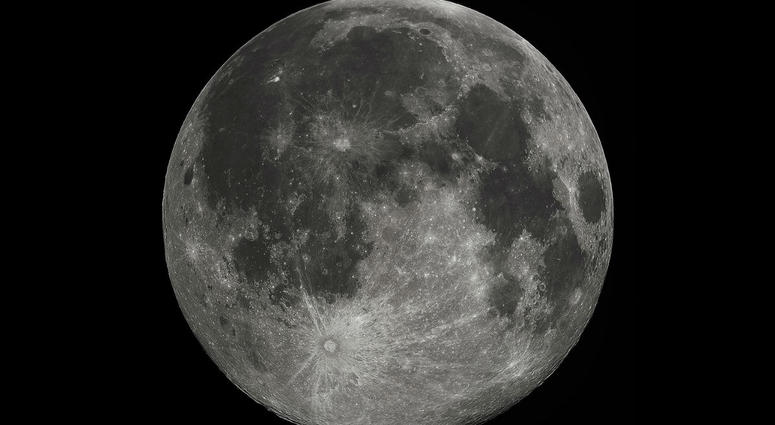 Full Moon in the darkness of the night sky. Full Moon in the darkness of the night sky.