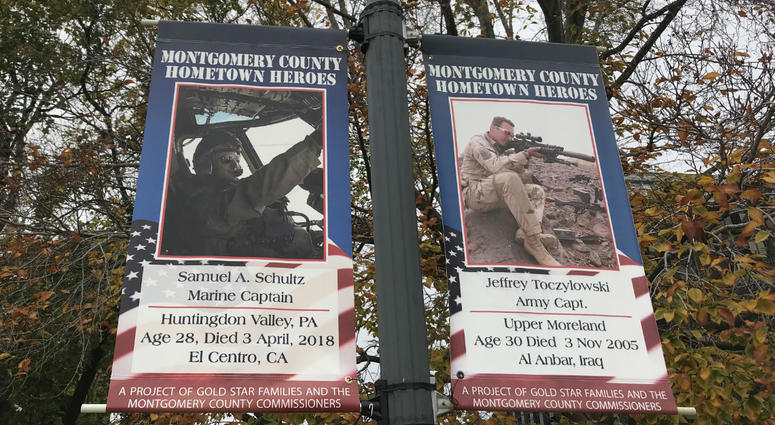 At left is a banner for Capt. Samuel Schultz, joining 17 others dedicated to men and women killed in service since Sept. 11, 2001. At left is a banner for Capt. Samuel Schultz, joining 17 others dedicated to men and women killed in service since Sept. 11, 2001.
