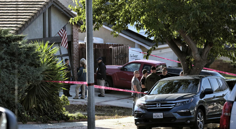 Ventura County Sheriff's deputies and FBI investigators stand outside the house of shooting suspect David Ian Long in Newbury Park, Calif., on Thursday, Nov. 8, 2018. Ventura County Sheriff's deputies and FBI investigators stand outside the house of shooting suspect David Ian Long in Newbury Park, Calif., on Thursday, Nov. 8, 2018.