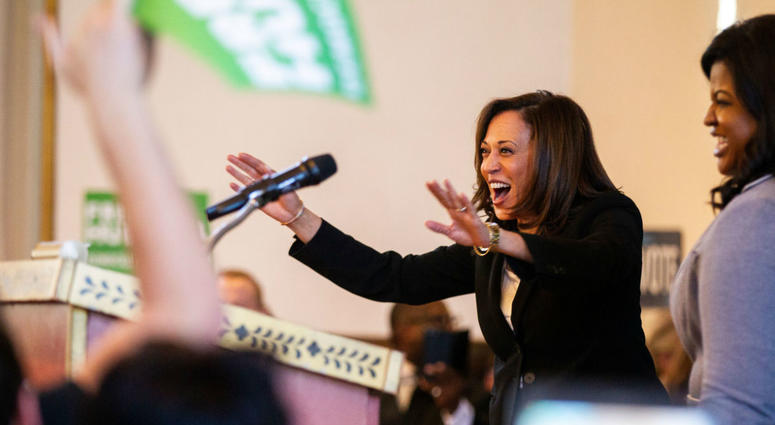 Sen. Kamala Harris, D-CA, waves to supporters while being welcomed on stage by Deidre DeJear during a \"All Hands on Deck\" event on Tuesday, Oct. 23, 2018, at Old Brick in Iowa City. Sen. Kamala Harris, D-CA, waves to supporters while being welcomed on stage by Deidre DeJear during a \"All Hands on Deck\" event on Tuesday, Oct. 23, 2018, at Old Brick in Iowa City.
