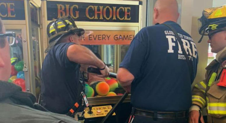 Emergency crews rescue a child from a game at the Gloucester Premium Outlets in Blackwood, N.J. Emergency crews rescue a child from a game at the Gloucester Premium Outlets in Blackwood, N.J.