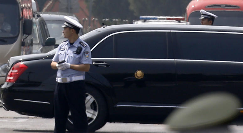 The motorcade that is believed be carrying North Korea leader Kim Jong Un, passes by policemen as it leaves the Beijing Capital International Airport in Beijing, Tuesday, June 19, 2018. The motorcade that is believed be carrying North Korea leader Kim Jong Un, passes by policemen as it leaves the Beijing Capital International Airport in Beijing, Tuesday, June 19, 2018.