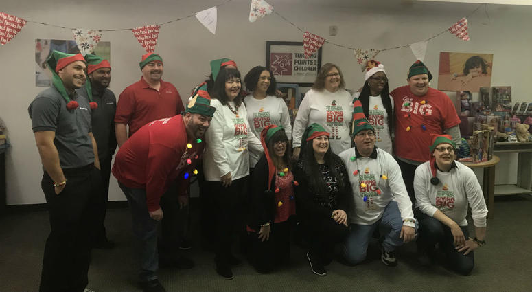 Workers at Mattress Firm collect Christmas toys for foster kids. Workers at Mattress Firm collect Christmas toys for foster kids.