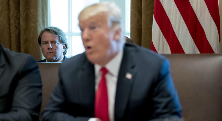 In this Aug. 16, 2018, file photo White House counsel Donald McGahn, left, listens as President Donald Trump speaks during a cabinet meeting in the Cabinet Room of the White House in Washington. In this Aug. 16, 2018, file photo White House counsel Donald McGahn, left, listens as President Donald Trump speaks during a cabinet meeting in the Cabinet Room of the White House in Washington.