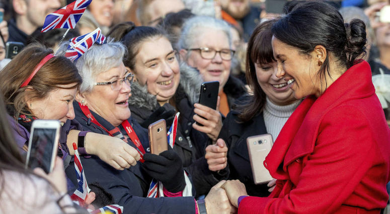 Meghan, Duchess of Sussex speaks with members of the public during a walkabout of Hamilton Square as part of a visit to a new sculpture marking the 100th anniversary of war poet Wilfred Owen's death, in Birkenhead, northwest England, Monday, Jan. 14, 2019 Meghan, Duchess of Sussex speaks with members of the public during a walkabout of Hamilton Square as part of a visit to a new sculpture marking the 100th anniversary of war poet Wilfred Owen's death, in Birkenhead, northwest England, Monday, Jan. 14, 2019