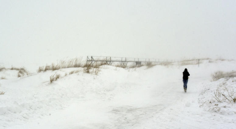 A hiker makes her way through blowing and drifting snow as she sprints back to her car Thursday, Jan. 31, 2019, at Tiscornia Park in St. Joseph, Mich. A hiker makes her way through blowing and drifting snow as she sprints back to her car Thursday, Jan. 31, 2019, at Tiscornia Park in St. Joseph, Mich.