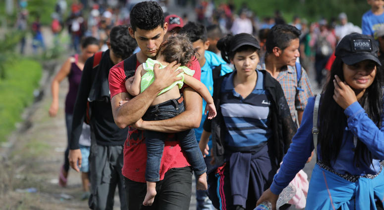 A caravan of Honduran migrants moves north after crossing the border from Honduras into Guatemala. Another migrant caravan is heading to the US.