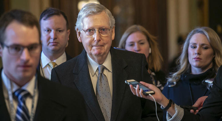 Senate Majority Leader Mitch McConnell, R-Ky., leaves the chamber after speaking about his plan to move a 1,300-page spending measure, which includes $5.7 billion to fund President Donald Trump's proposed wall. Senate Majority Leader Mitch McConnell, R-Ky., leaves the chamber after speaking about his plan to move a 1,300-page spending measure, which includes $5.7 billion to fund President Donald Trump's proposed wall.