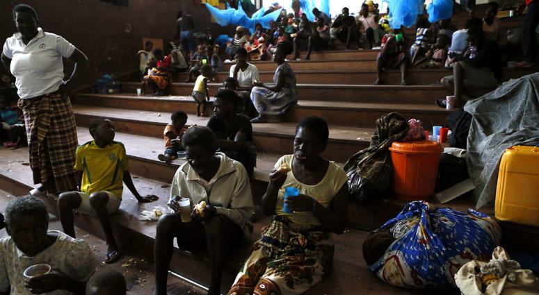 Displaced families, victims of Cyclone Idai, eat lunch at the Samora Machel Secondary School which is being used to house victims of the floods in Beira, Mozambique, Sunday March 24, 2019. Displaced families, victims of Cyclone Idai, eat lunch at the Samora Machel Secondary School which is being used to house victims of the floods in Beira, Mozambique, Sunday March 24, 2019.