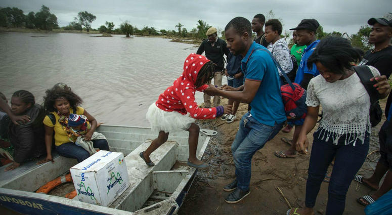 A young girl is helped from a boat after being evacuated from flood waters following cyclone force winds and heavy rain near the coastal city of Beira, Mozambique, Wednesday March 20, 2019. A young girl is helped from a boat after being evacuated from flood waters following cyclone force winds and heavy rain near the coastal city of Beira, Mozambique, Wednesday March 20, 2019.