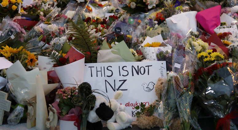 In this Saturday, March 16, 2019, file photo, flowers lay at a memorial near the Masjid Al Noor mosque for victims in last week's shooting in Christchurch, New Zealand. In this Saturday, March 16, 2019, file photo, flowers lay at a memorial near the Masjid Al Noor mosque for victims in last week's shooting in Christchurch, New Zealand.