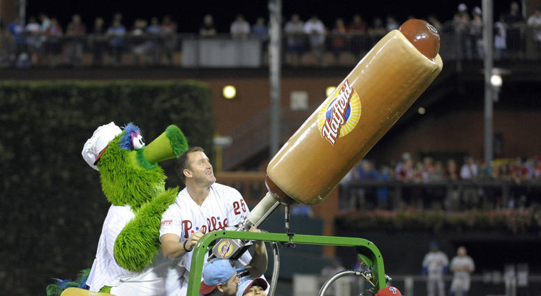 Philadelphia Phillies former player Jim Thome and the Phillie Phanatic shoot hot dogs into the crowd in between innings of game against the New York Mets at Citizens Bank Park on Aug. 9, 2014. Philadelphia Phillies former player Jim Thome and the Phillie Phanatic shoot hot dogs into the crowd in between innings of game against the New York Mets at Citizens Bank Park on Aug. 9, 2014.