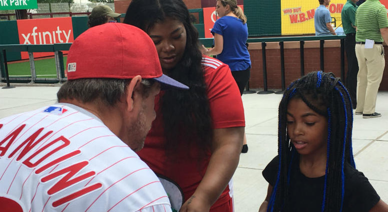Former Phillies second baseman and coach Mickey Morandini, now a team ambassador, speaks with a youngster about the supplies she'll need for school this fall. Former Phillies second baseman and coach Mickey Morandini, now a team ambassador, speaks with a youngster about the supplies she'll need for school this fall.