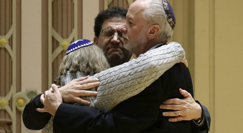 Rabbi Jeffrey Myers, right, of Tree of Life/Or L'Simcha Congregation hugs Rabbi Cheryl Klein, left, of Dor Hadash Congregation and Rabbi Jonathan Perlman during a community gathering held in the aftermath of a deadly shooting at the Tree of Life Synagogue Rabbi Jeffrey Myers, right, of Tree of Life/Or L'Simcha Congregation hugs Rabbi Cheryl Klein, left, of Dor Hadash Congregation and Rabbi Jonathan Perlman during a community gathering held in the aftermath of a deadly shooting at the Tree of Life Synagogue