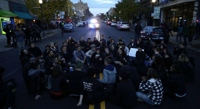 Protesters demonstrate on a main road in the Squirrel Hill neighborhood of Pittsburgh Tuesday, Oct. 30, 2018. Protesters demonstrate on a main road in the Squirrel Hill neighborhood of Pittsburgh Tuesday, Oct. 30, 2018.