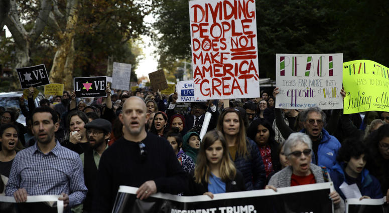 Protesters demonstrate near Pittsburgh's Tree of Life Synagogue where President Donald Trump and first lady Melania Trump were visiting a memorial in Pittsburgh, Tuesday, Oct. 30, 2018. Protesters demonstrate near Pittsburgh's Tree of Life Synagogue where President Donald Trump and first lady Melania Trump were visiting a memorial in Pittsburgh, Tuesday, Oct. 30, 2018.