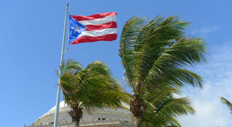 Flag of the Commonwealth of Puerto Rico in front of Capitolio, San Juan, Puerto Rico. Flag of the Commonwealth of Puerto Rico in front of Capitolio, San Juan, Puerto Rico.