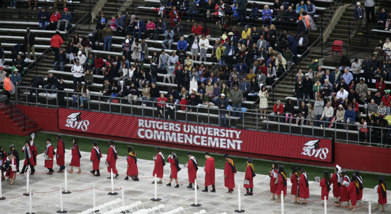 In this May 13, 2018, file photo, new graduates walk into the High Point Solutions Stadium before the start of the Rutgers University graduation ceremony in Piscataway Township, N.J. In this May 13, 2018, file photo, new graduates walk into the High Point Solutions Stadium before the start of the Rutgers University graduation ceremony in Piscataway Township, N.J.