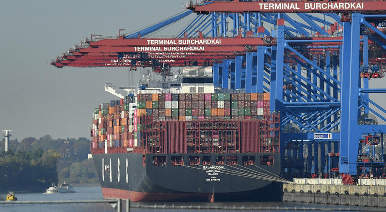In this Monday, Oct. 15, 2018 file photo, a container ship is loaded at the harbor in Hamburg, Germany. In this Monday, Oct. 15, 2018 file photo, a container ship is loaded at the harbor in Hamburg, Germany.