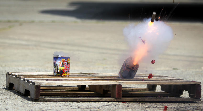 Fireworks tip over and explode during a safety demonstration at the Illinois Fire Safety Alliance building in Mount Prospect, Illinois, July 3, 2012. Fireworks safety demonstration