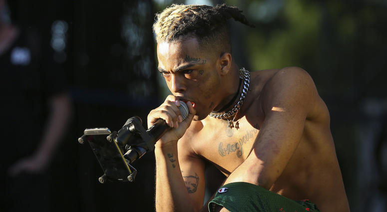 XXXTentacion performs during the second day of the Rolling Loud Festival in downtown Miami on May 6, 2017. XXXTentacion