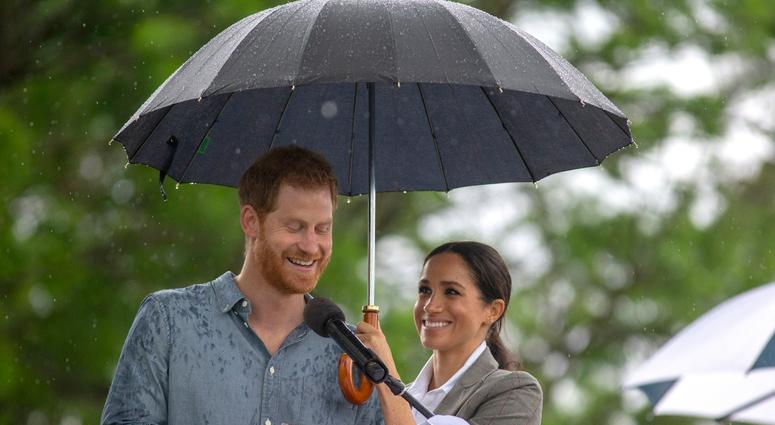 10/17/2018 - The Duchess of Sussex holds an umbrella as the Duke of Sussex makes a speech at a community picnic in Victoria Park in Dubbo, New South Wales, on the second day of the royal couple's visit to Australia. 10/17/2018 - The Duchess of Sussex holds an umbrella as the Duke of Sussex makes a speech at a community picnic in Victoria Park in Dubbo, New South Wales, on the second day of the royal couple's visit to Australia.