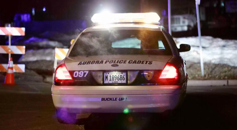 A police car is seen near the manufacturing plant where a mass shooting incident occurred in Aurora, the United States, on Feb. 15, 2019. Illinois Shooting