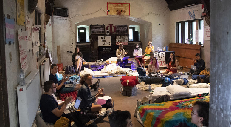 Students sing songs and protest during a sit-in inside the main hall of a fraternity house at Swarthmore College, April 30, 2019. Swarthmore College sit-in