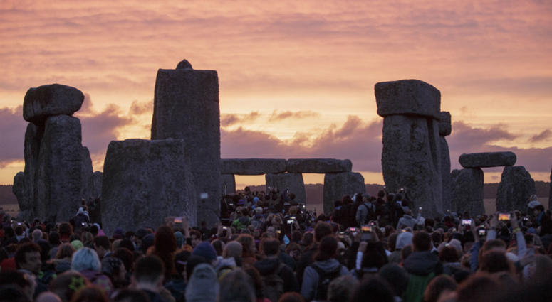 In this Sunday, June 21, 2015 file photo, the sun rises as thousands of revellers gather at the ancient stone circle Stonehenge to celebrate the Summer Solstice, near Salisbury, England. In this Sunday, June 21, 2015 file photo, the sun rises as thousands of revellers gather at the ancient stone circle Stonehenge to celebrate the Summer Solstice, near Salisbury, England.