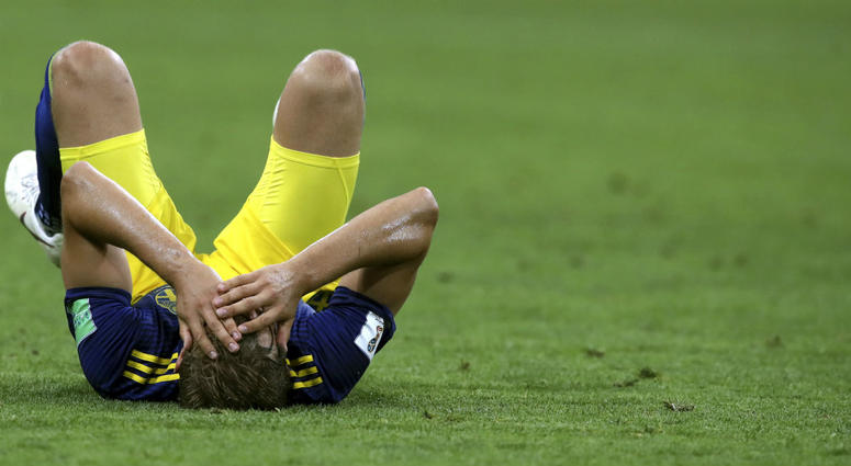Sweden's Ludwig Augustinsson holds his head as he lies on the pitch at the end of the group F match between Germany and Sweden at the 2018 soccer World Cup in the Fisht Stadium in Sochi, Russia, Saturday, June 23, 2018. Germany won 2-1. Sweden's Ludwig Augustinsson holds his head as he lies on the pitch at the end of the group F match between Germany and Sweden at the 2018 soccer World Cup in the Fisht Stadium in Sochi, Russia, Saturday, June 23, 2018. Germany won 2-1.
