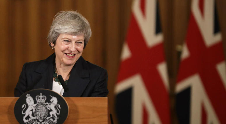 Britain's Prime Minister Theresa May smiles during a press conference inside 10 Downing Street in London, Thursday, Nov. 15, 2018. Britain's Prime Minister Theresa May smiles during a press conference inside 10 Downing Street in London, Thursday, Nov. 15, 2018.